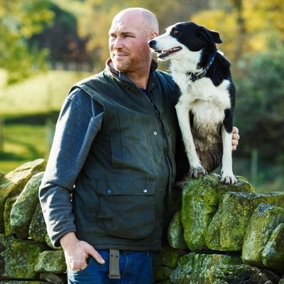 Man and his dog looking onto the horizon